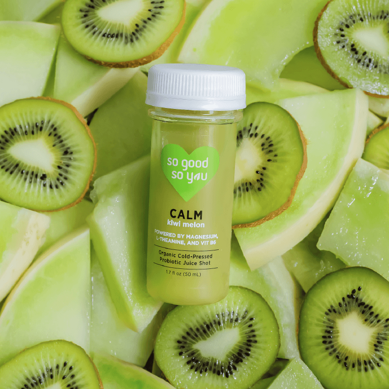 Calm Juice Shot on top of raw kiwi and melon